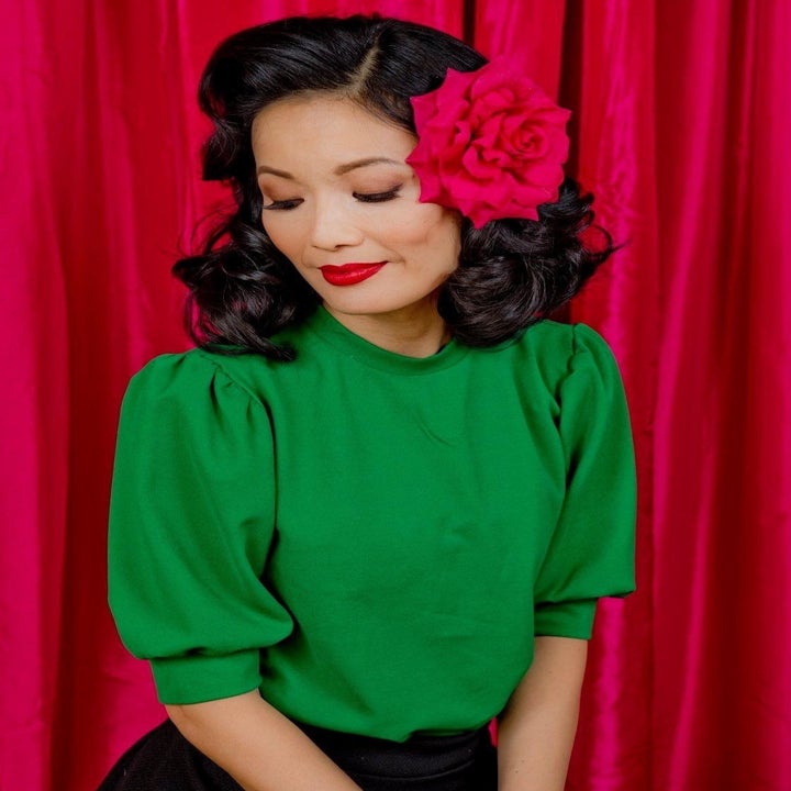 reviewer wearing the green blouse