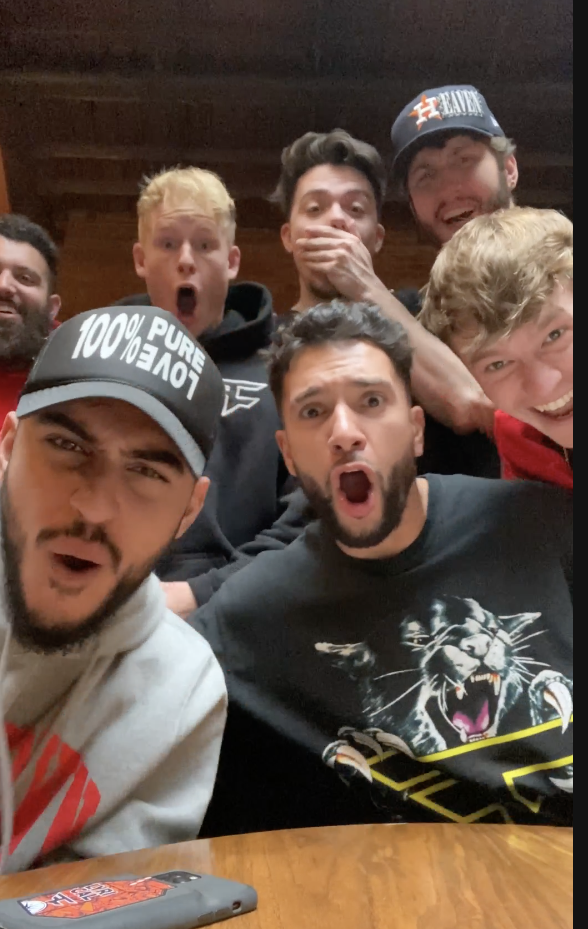 Some men react with open mouths to an epic burn