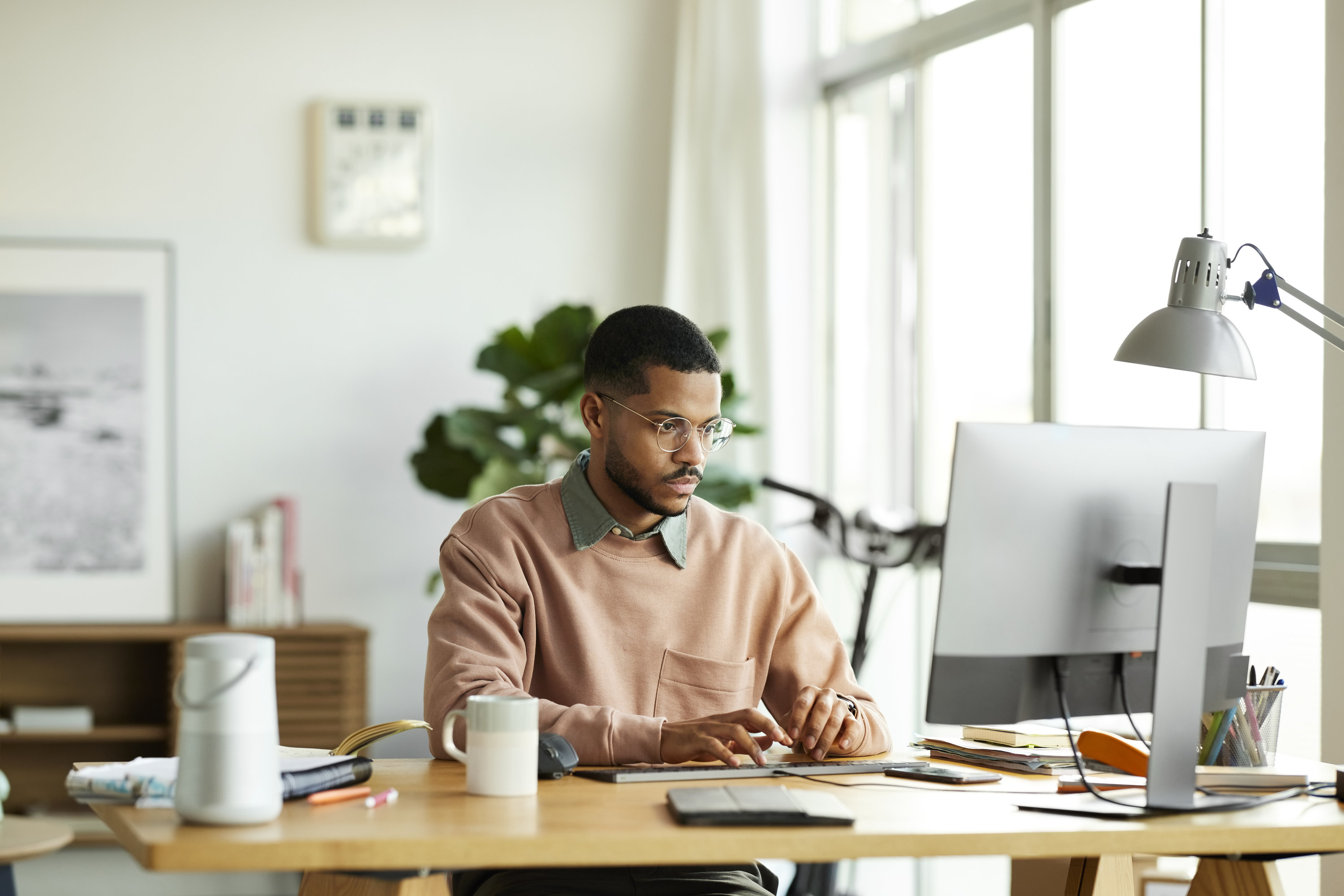 Man sitting at his home computer, getting ready for an interview