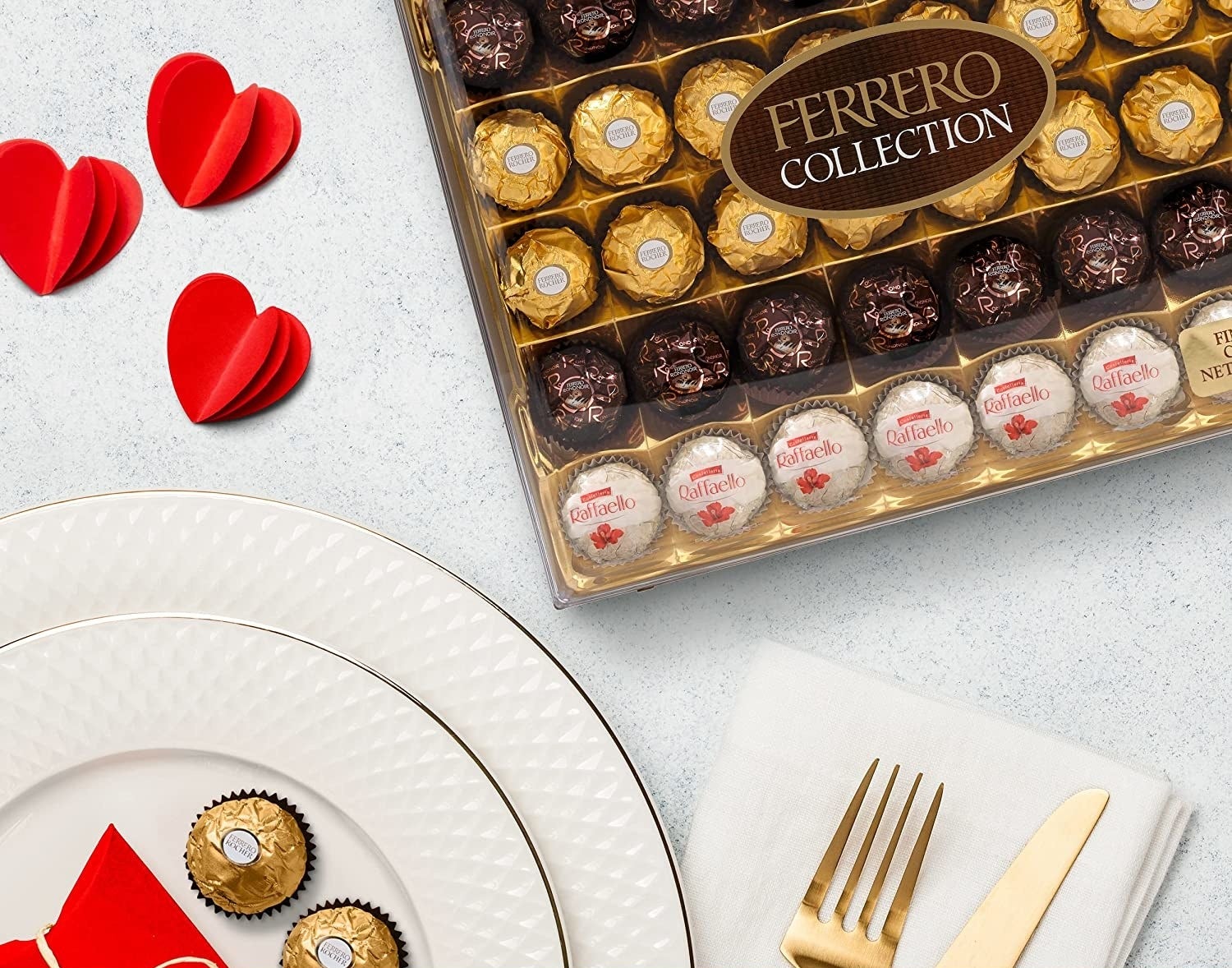 The 48-piece Ferrero Rocher Collection variety pack next to some plates