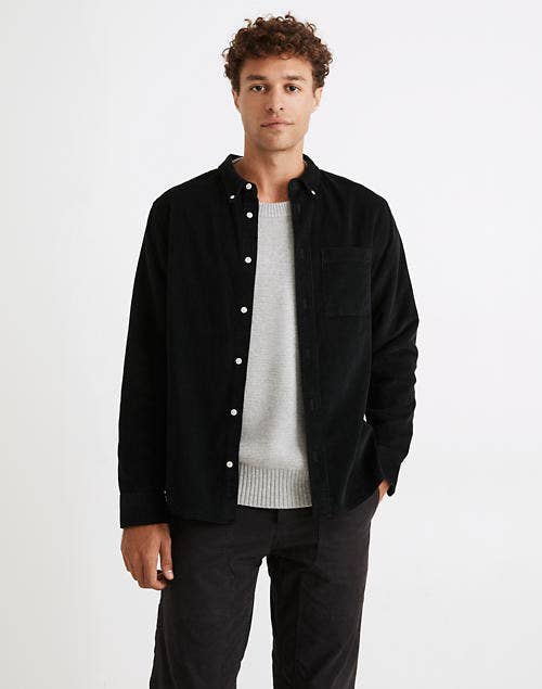 Model wearing a black corduroy button down