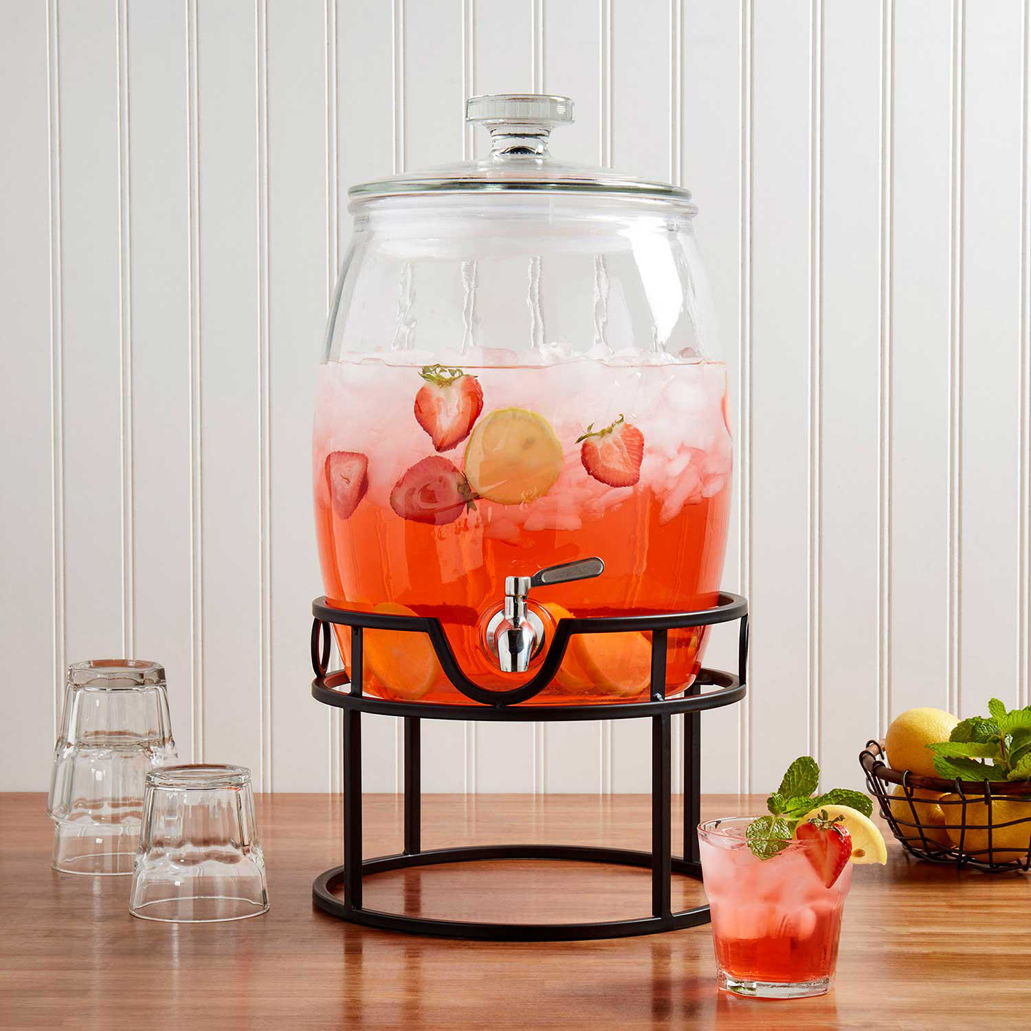 A drink dispenser filled with a strawberry drink