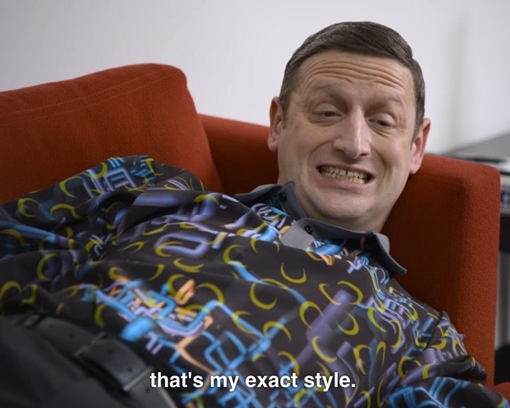 Character wearing a shirt from Dan Flashes with a wild print saying that's my exact style