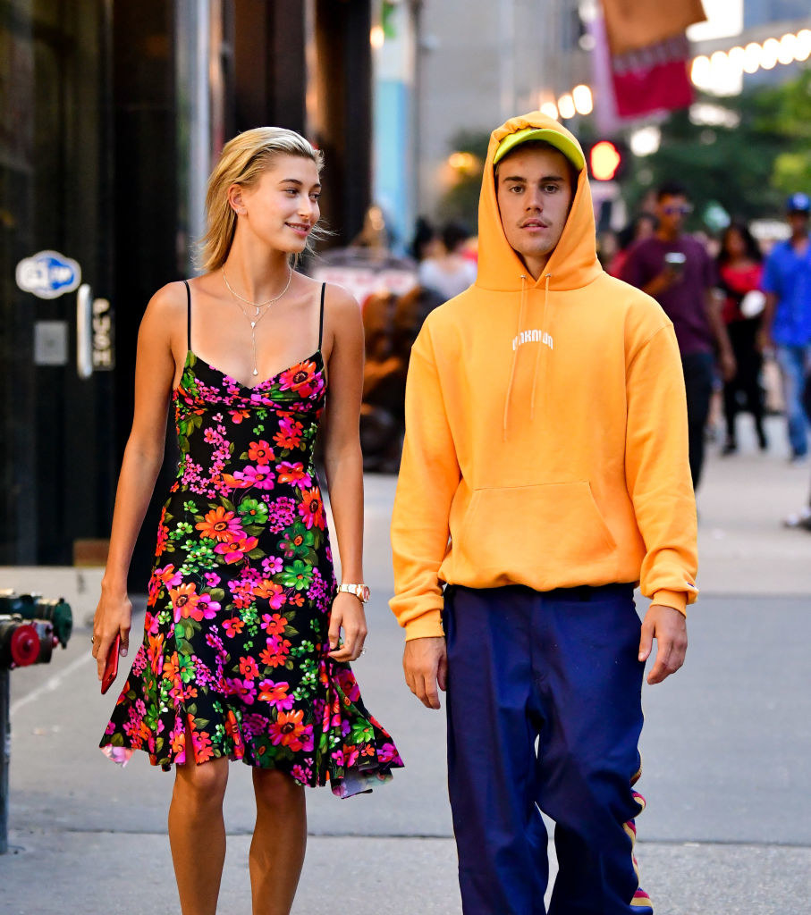 The couple walking down the sidewalk