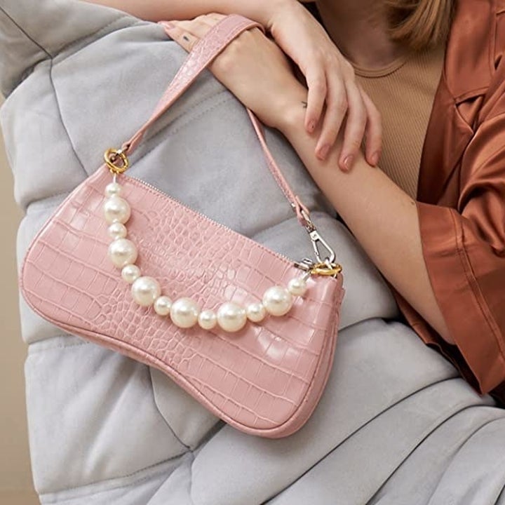 the same pearl attachment on a baguette bag