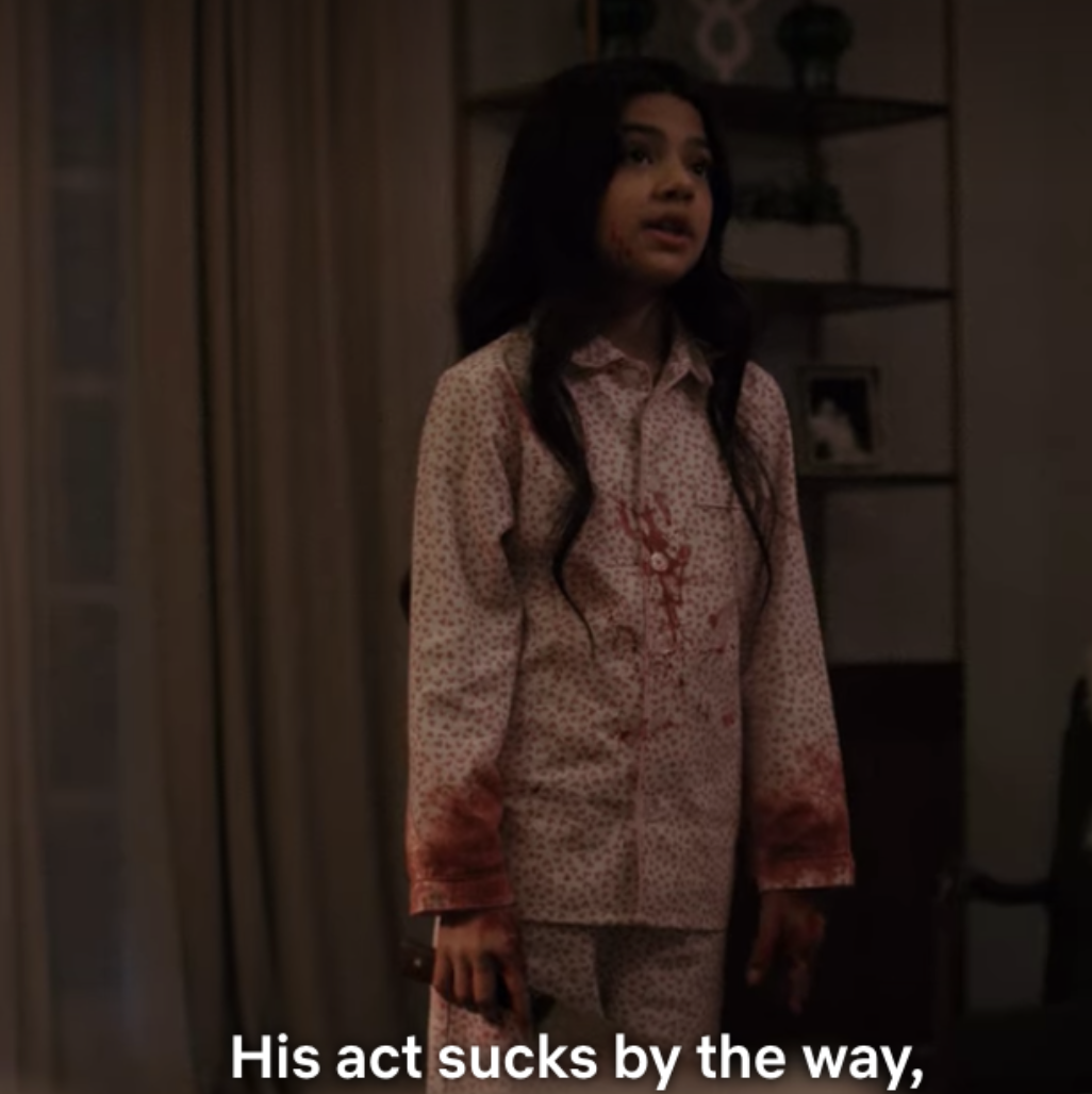 A young girl, Emma is bleeding while holding a weapon and saying, &quot;His act sucks by the way.&quot;