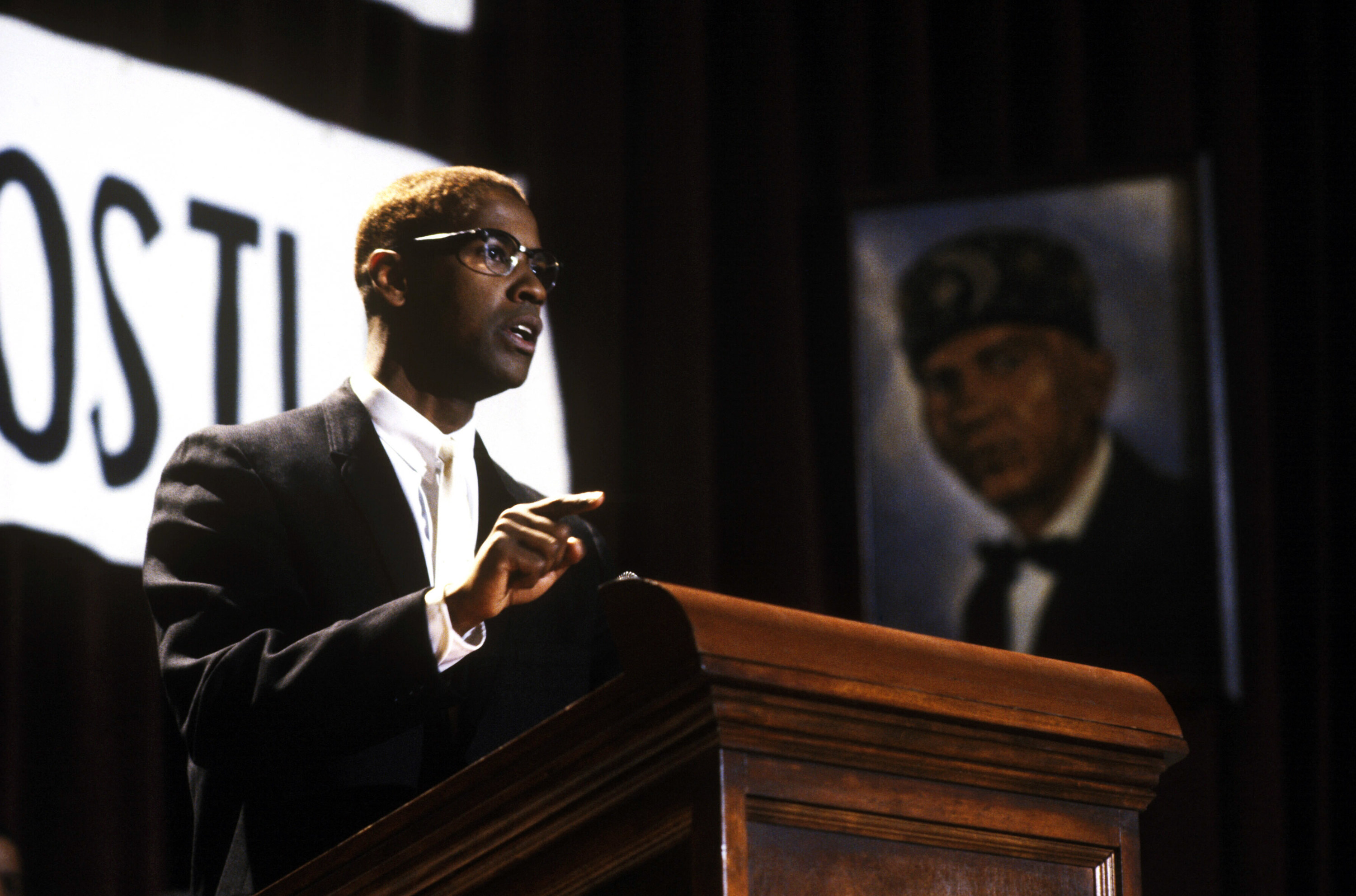 Malcolm X gives a speech at a podium