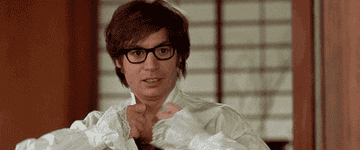 Austin Powers opening up his buttoned shirt