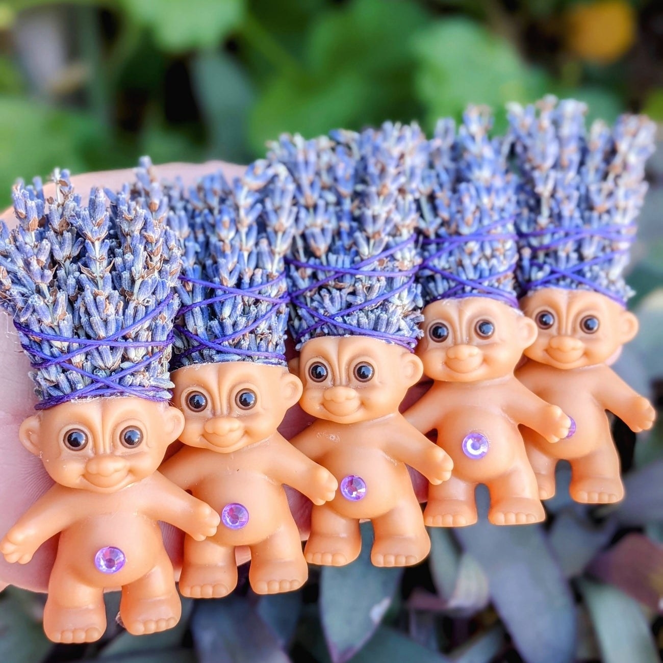 A bundle of the lavender troll dolls