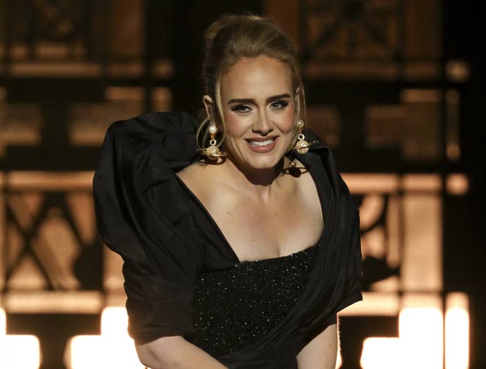 Adele smiles on stage