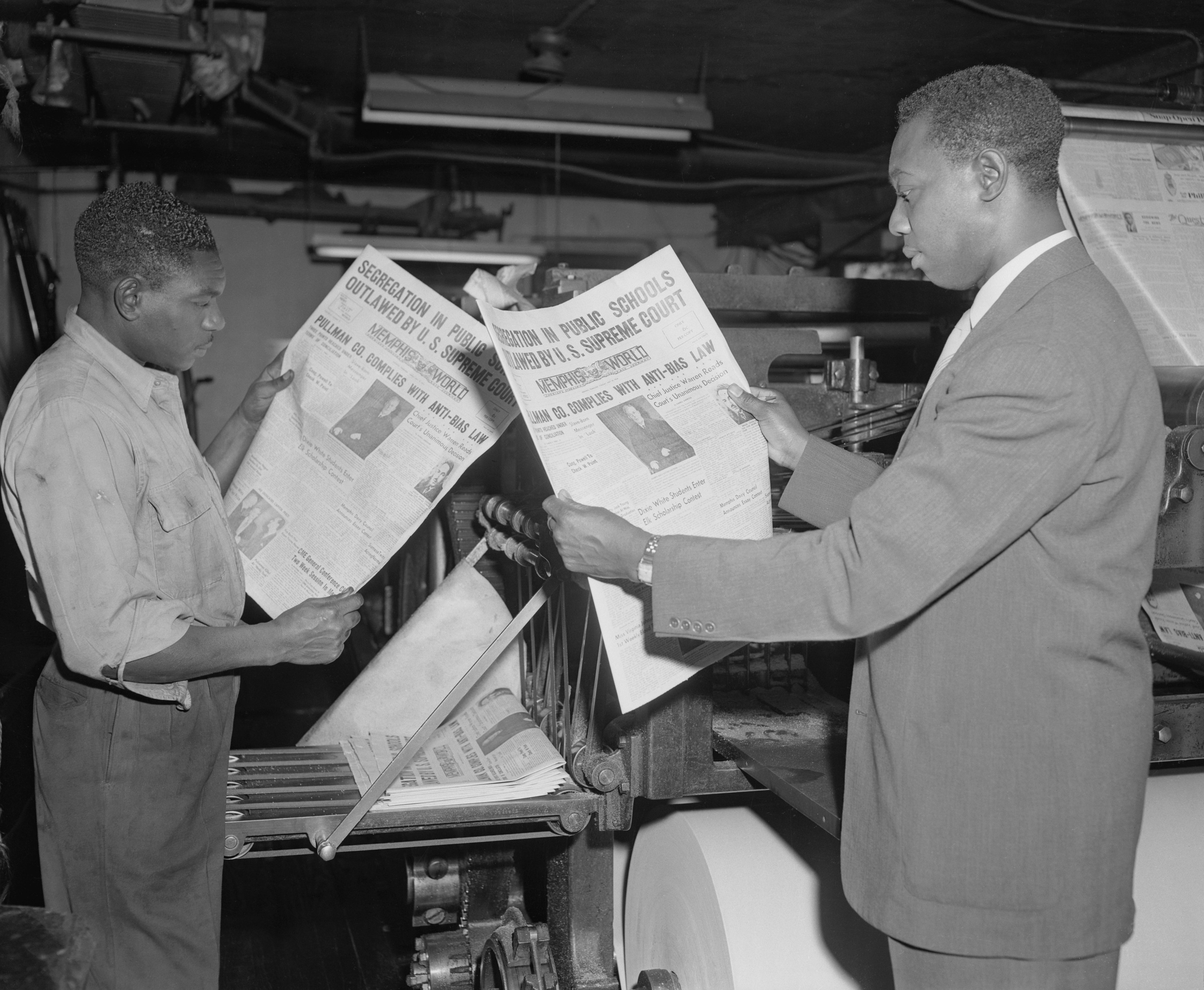 Men reading newspapers
