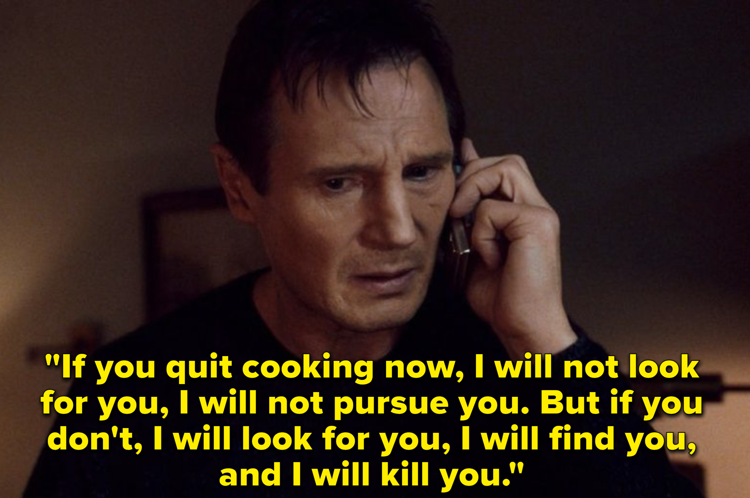 Liam Neeson talking on the phone