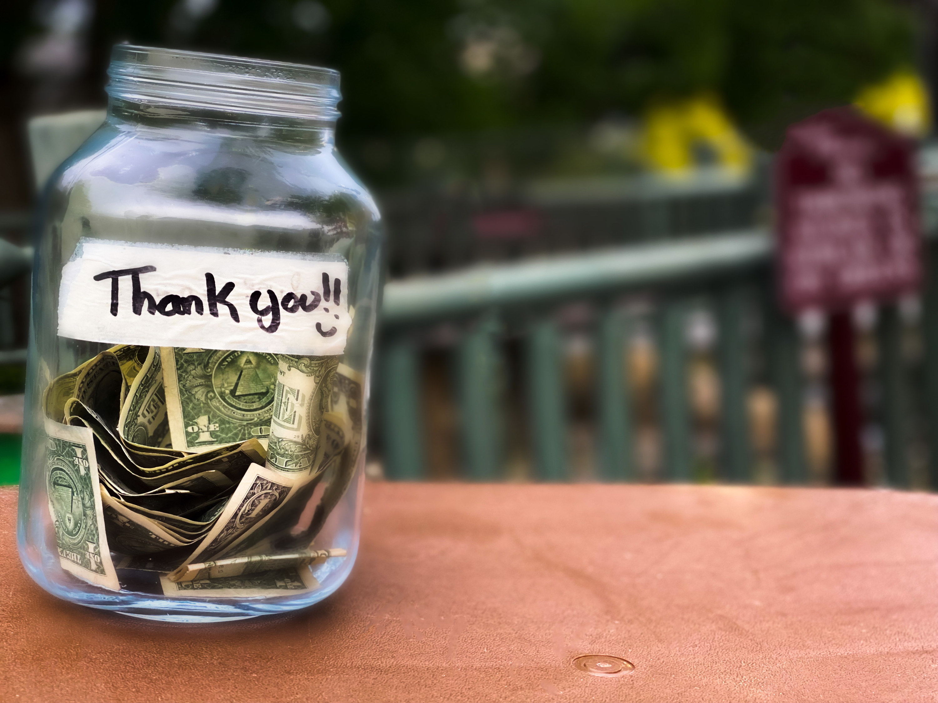 Tip jar with a note that says &quot;Thank you!&quot;