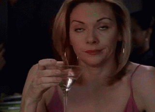 Samantha drinking a martini