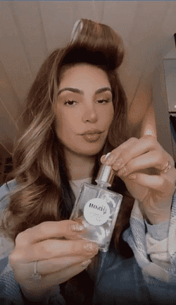 a gif off the CEO using the hair oil