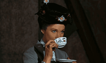 Mary Poppins from &quot;Mary Poppins&quot; sipping tea and smiling