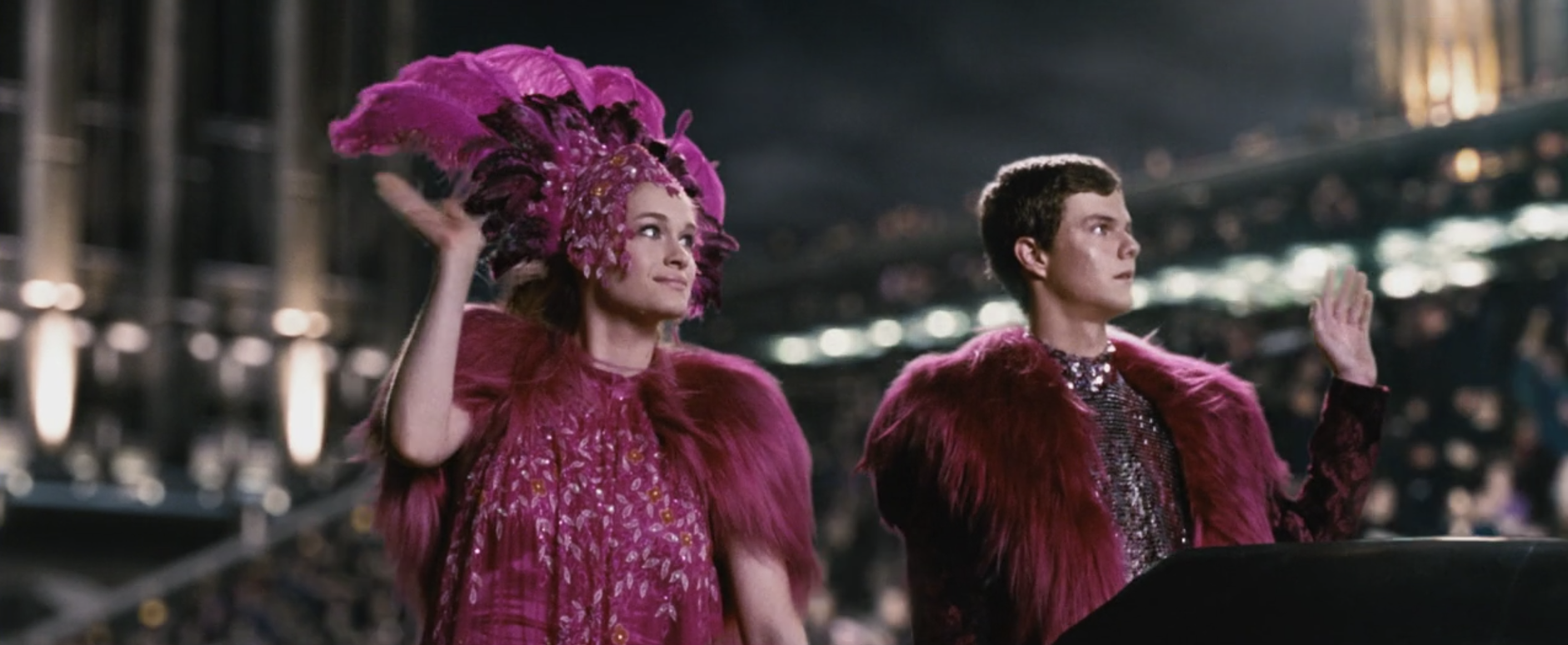 The two tributes dressed in bright pink and sequined showgirl outfits