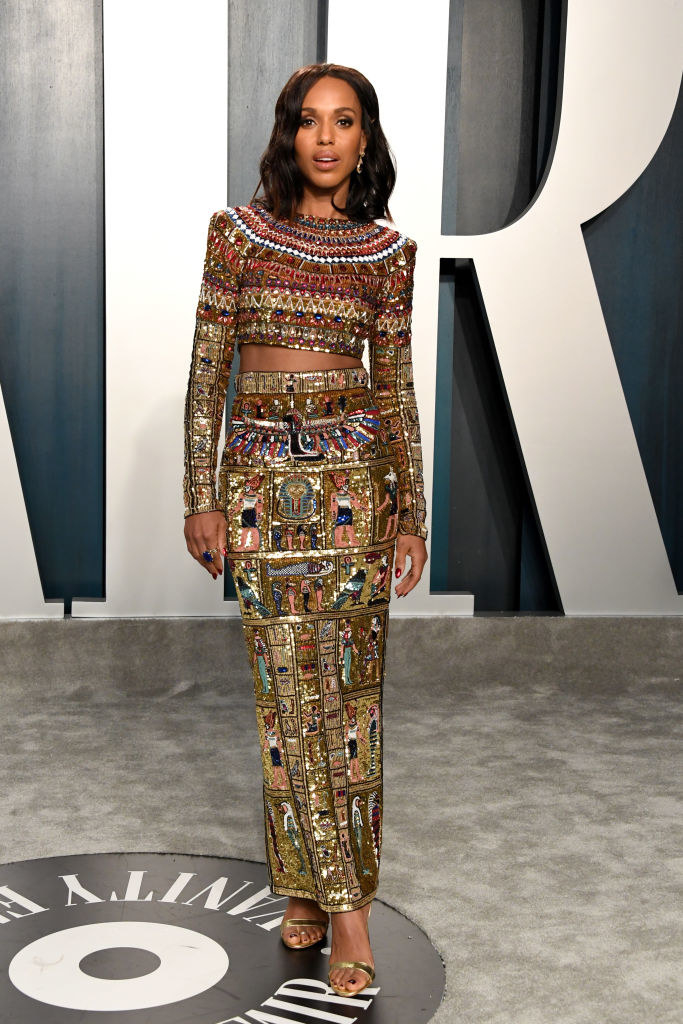 a two-piece long-sleeved dress covered in Egyptian hieroglyphics