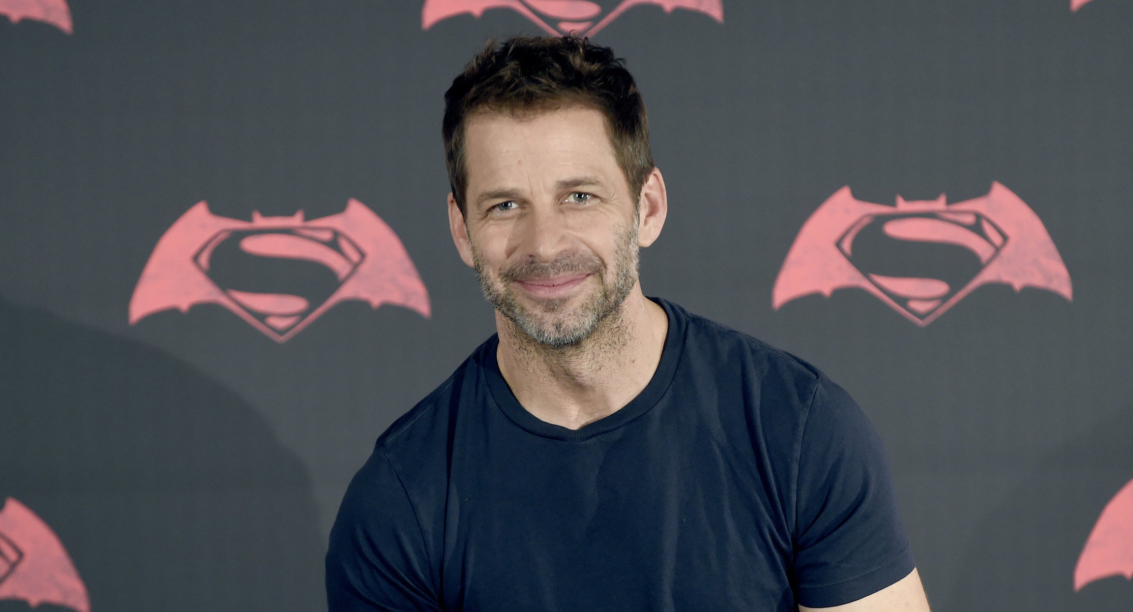 Director Zack Snyder with a banner for &quot;Batman v Superman: Dawn of Justice&quot; behind him