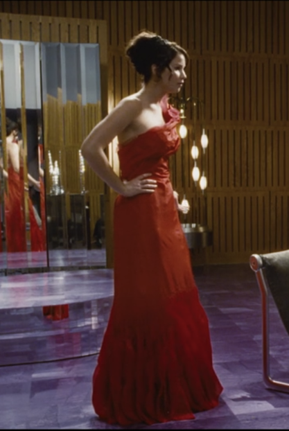 Katniss wearing a full length red gown