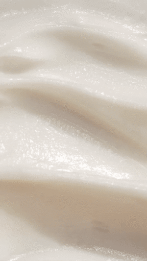 gif of an application tool running across the moisturizer to show the smooth consistency