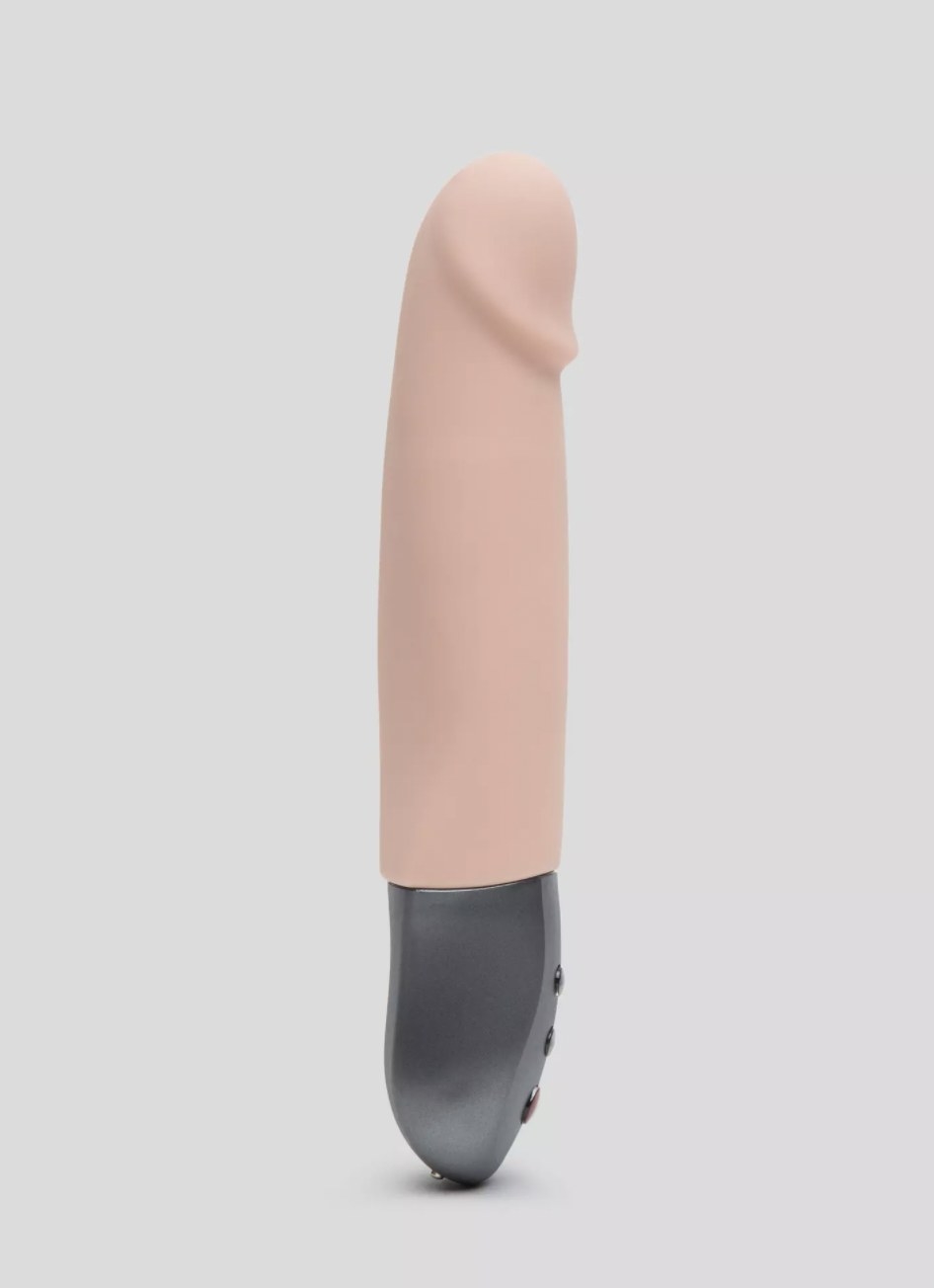 The pink, light-skin colored thrusting vibrator