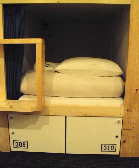 Hotel room consisting of bunk bed and locker in a (now defunct) capsule hotel in Kyoto, Japan