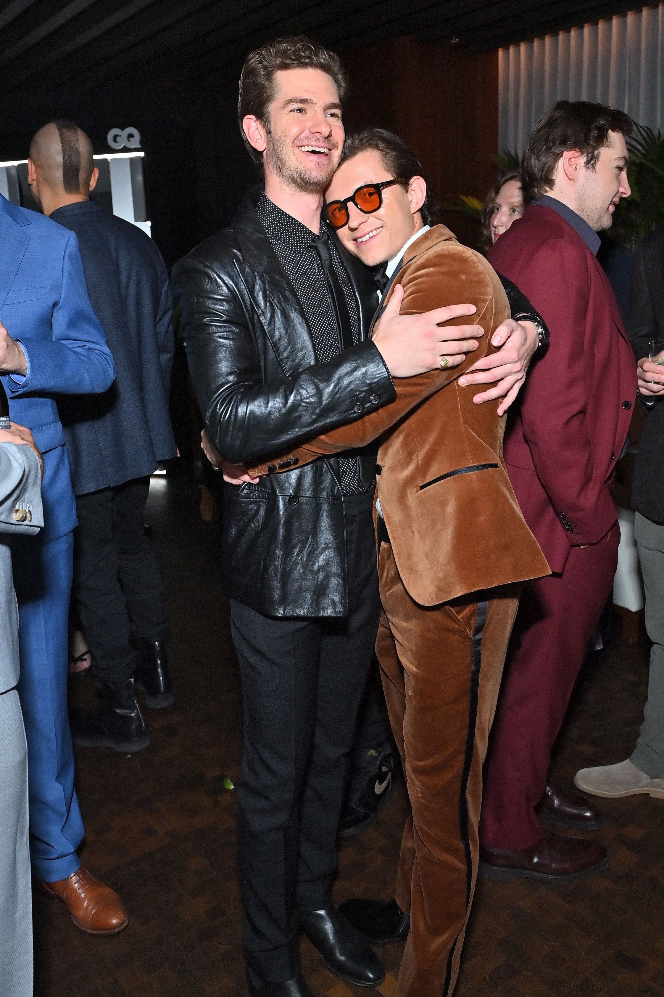 Andrew and Tom hugging at GQ event