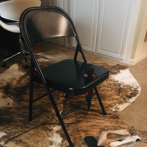 Black folding chair with black wand vibrator