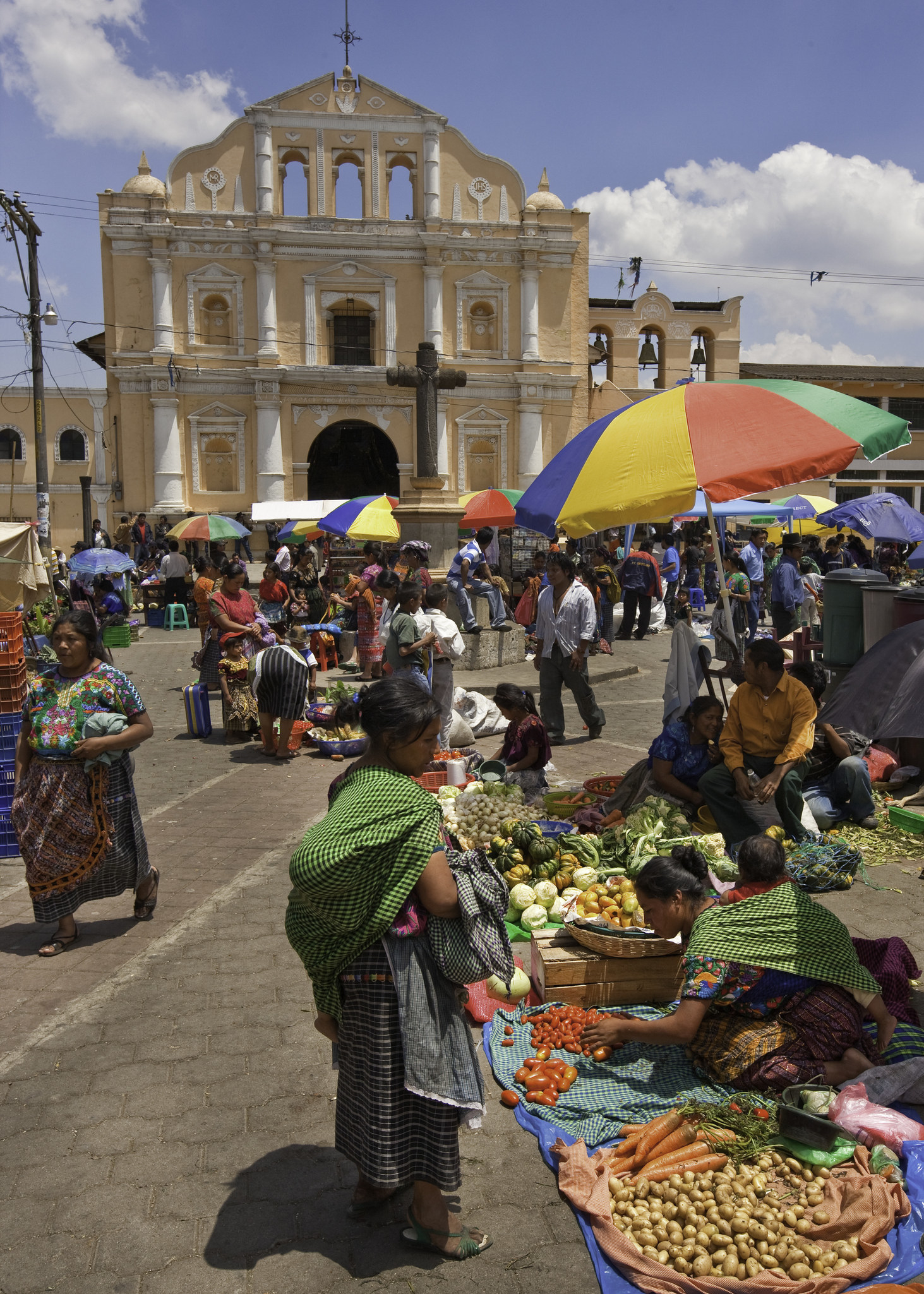 An outdoor market in front of a church