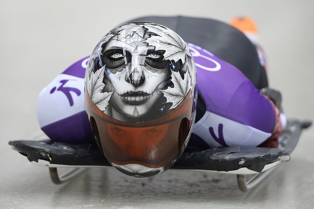 Sarah&#x27;s helmet features a stylized face peering out from behind several leaves