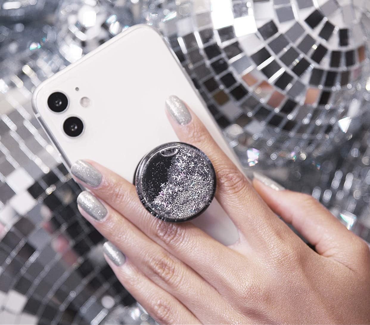 someone holding their phone using the glittery popsocket