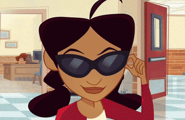 Penny Proud takes down her sunglasses and wriggles her eyebrows.