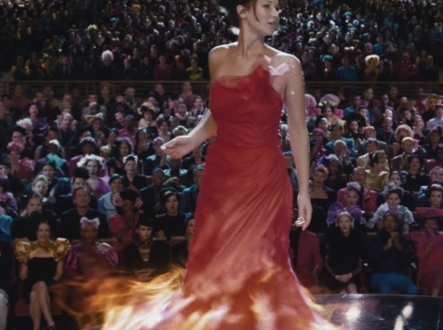 Katniss twirls as the Capitol audience watches