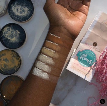 model's arm showing swatches of the different setting powder shades
