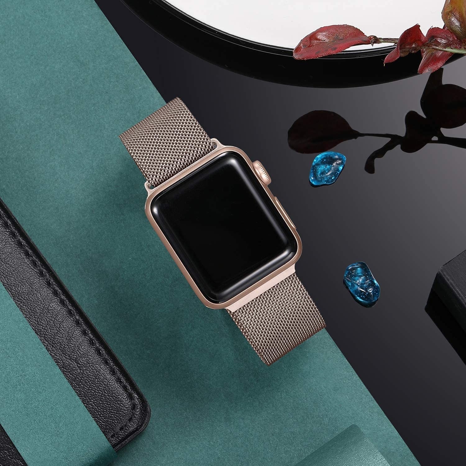 a steel mesh apple watch band worn with a matching apple watch