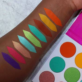 model's arm with swatches of the different eyeshadow colors