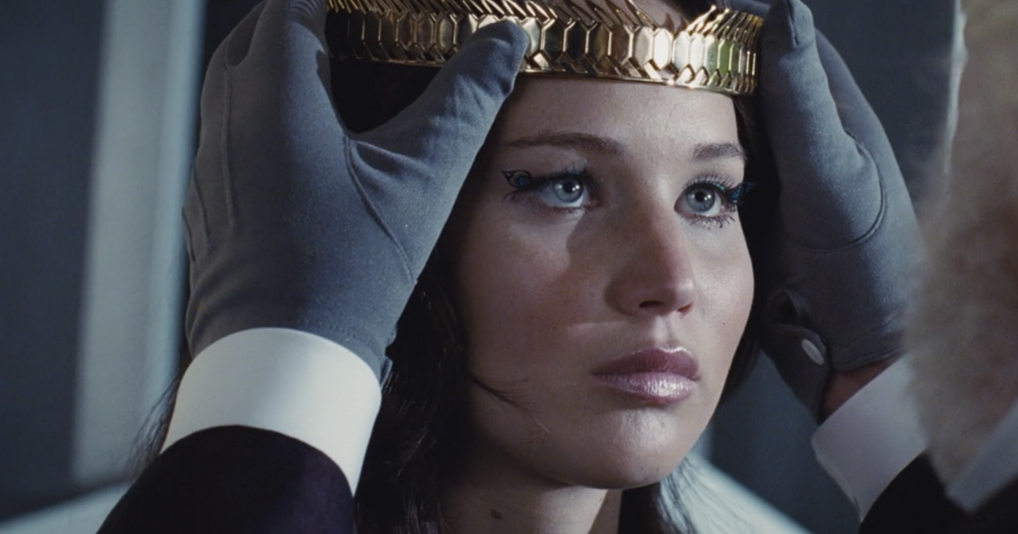 Katniss being crowned with a golden circlet
