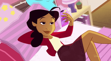 Penny Proud is seen on her bed looking at her new modern device.