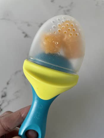 The silicone teether with frozen fruit inside