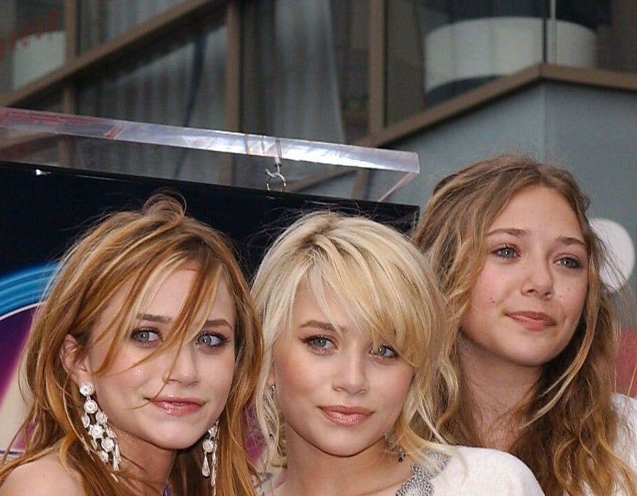 Mary-Kate Olsen and Ashley Olsen with sister Lizzie at the hollywood walk of fame