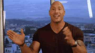 The Rock rubbing his hands together