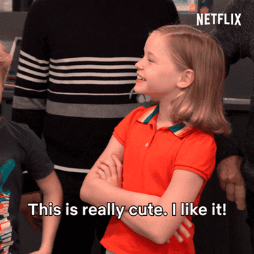 A gif of a child saying &quot;this is really cute I like it&quot; while looking around a room