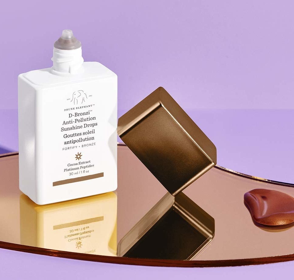 the serum container next to a pool of the bronze serum