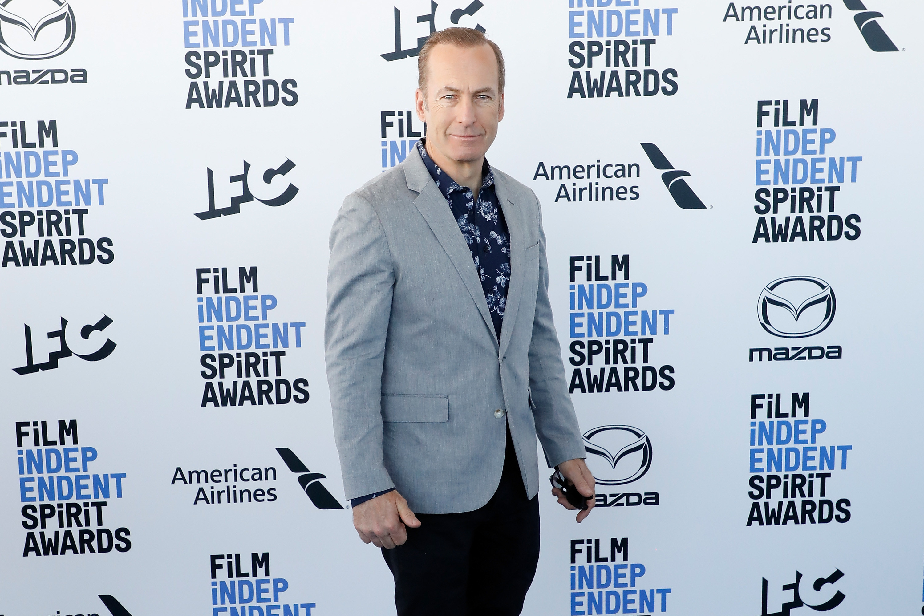 Odenkirk poses for a photo at a step-and-repeat