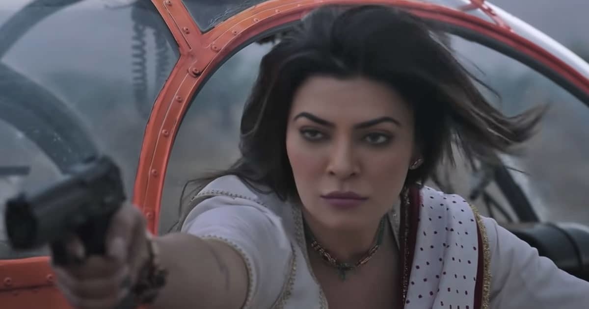 Sushmita Sen points a gun at someone while getting out of a helicopter