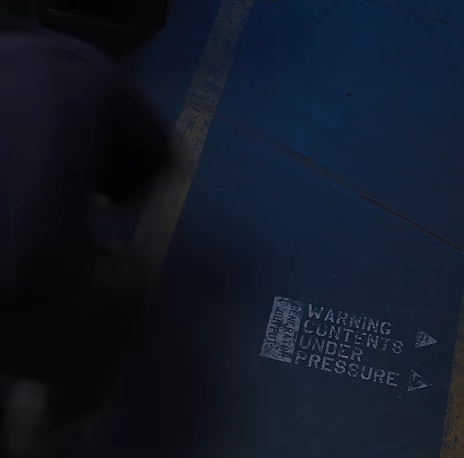 &quot;Warning: Contents Under Pressure&quot; sign in Avengers