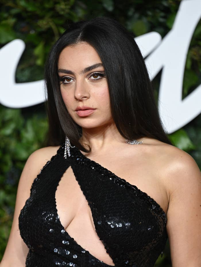 Charli poses for a picture at an event