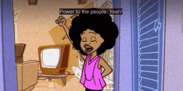 Penny Proud pushes her fist into the air proudly.