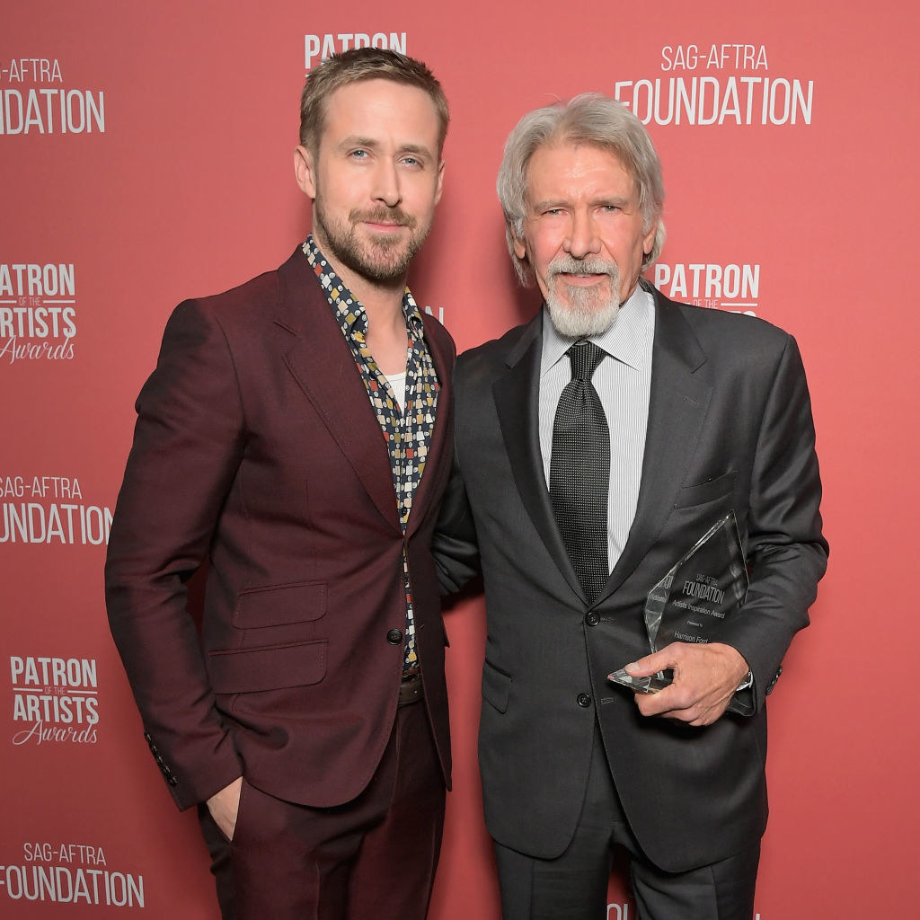 Ryan is with harrison ford at an award show